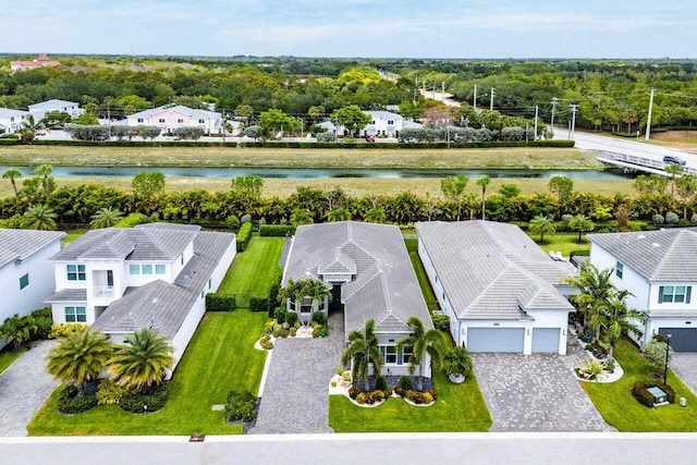 drone / aerial view featuring a water view and a residential view