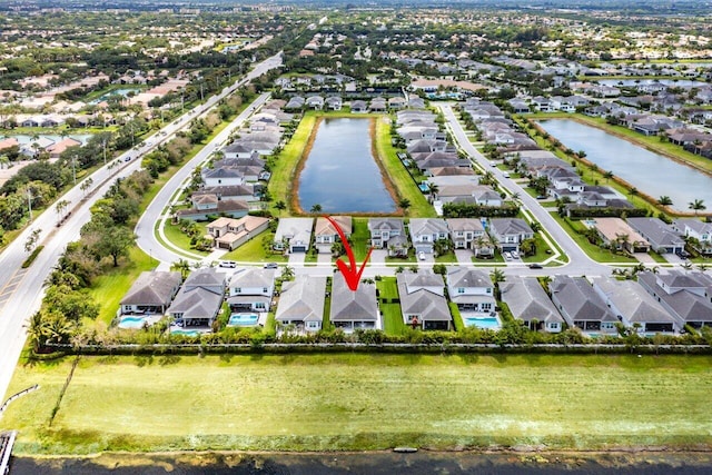 aerial view with a residential view and a water view