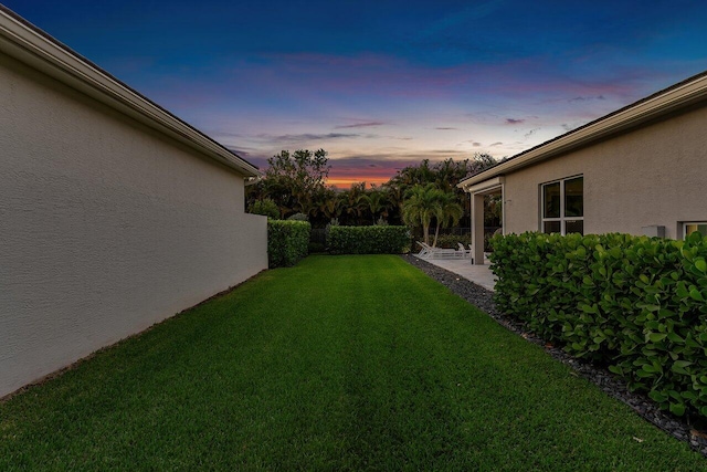 view of yard featuring a patio and fence