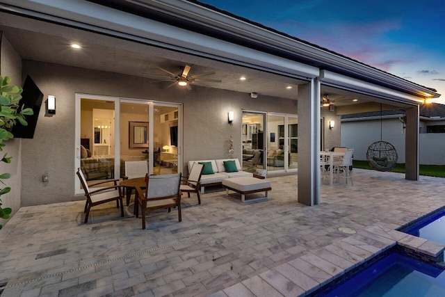 view of patio / terrace with an outdoor hangout area, outdoor dining space, ceiling fan, and an outdoor pool