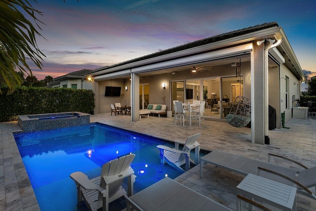 view of swimming pool with outdoor dining space, a patio, a pool with connected hot tub, and outdoor lounge area
