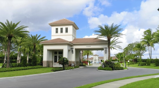 view of front of house with stucco siding and stone siding