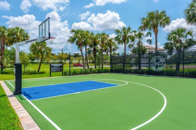 view of basketball court featuring fence and community basketball court