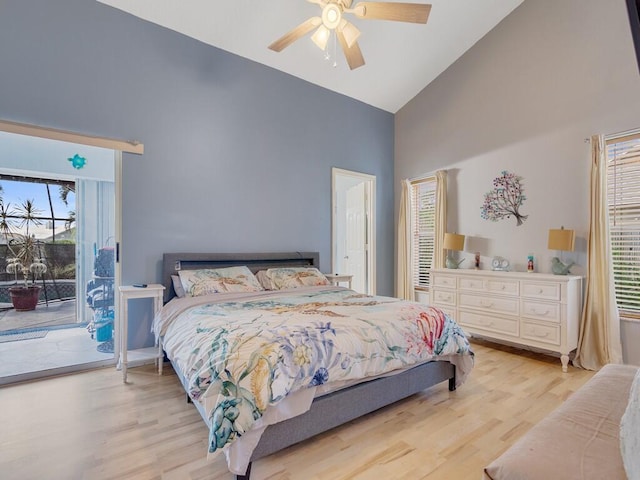 bedroom with access to outside, light wood-style flooring, ceiling fan, and high vaulted ceiling
