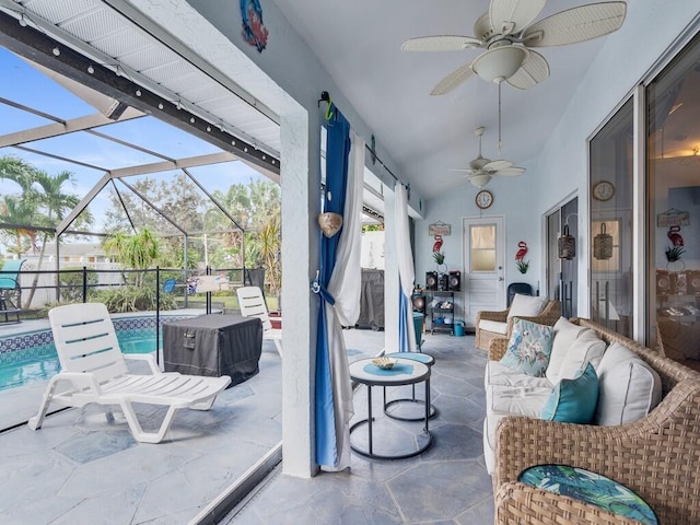 view of patio featuring a lanai, ceiling fan, and an outdoor pool