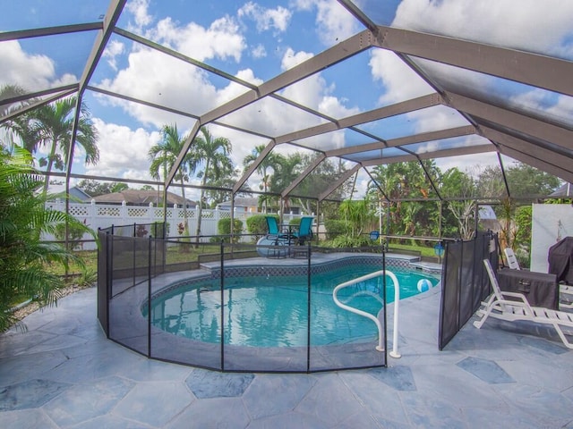 view of swimming pool with a fenced in pool, fence, and a patio