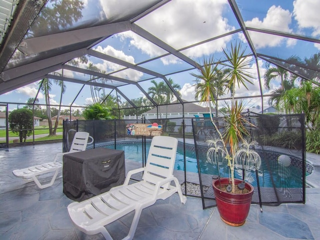 view of patio featuring a fenced in pool and a lanai