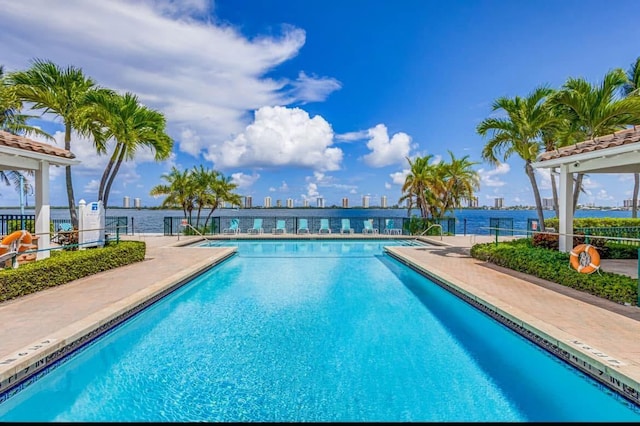 1120 Lake Shore Dr Unit 206, Lake Park, FL 33403 - community pool featuring fence