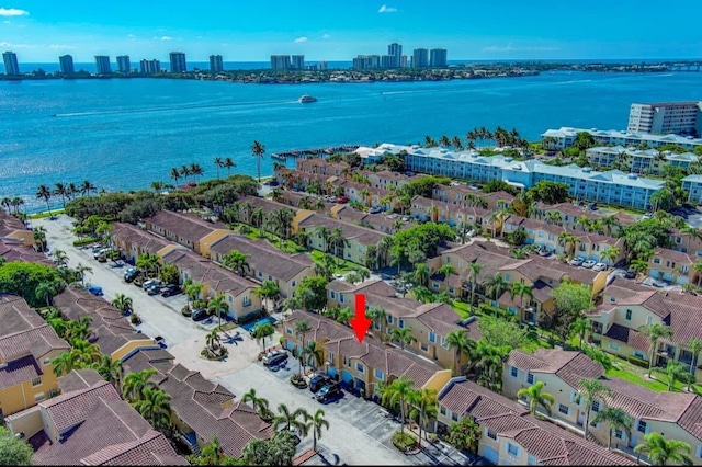 1120 Lake Shore Dr Unit 206, Lake Park, FL 33403 - drone / aerial view featuring a view of city and a water view