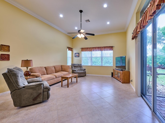 living room with visible vents, ornamental molding, baseboards, and light tile patterned floors