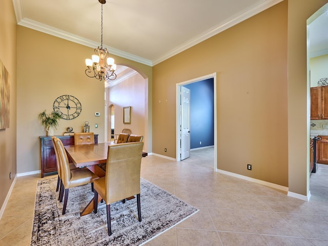 dining room featuring crown molding, arched walkways, an inviting chandelier, and light tile patterned floors