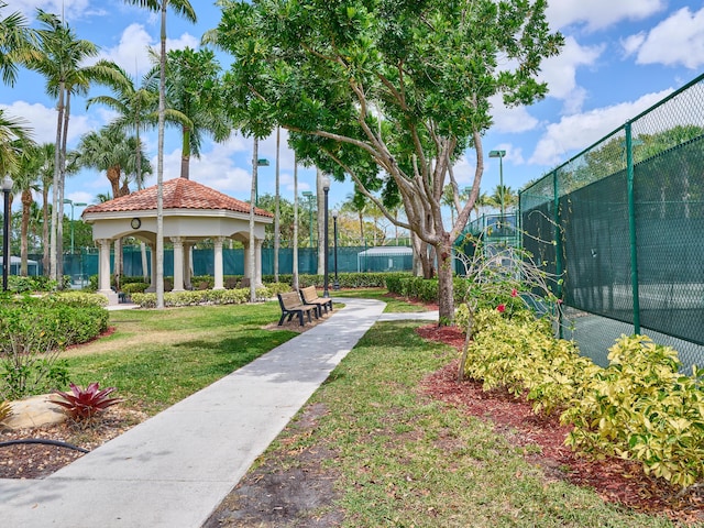 view of home's community featuring a yard, a gazebo, and fence