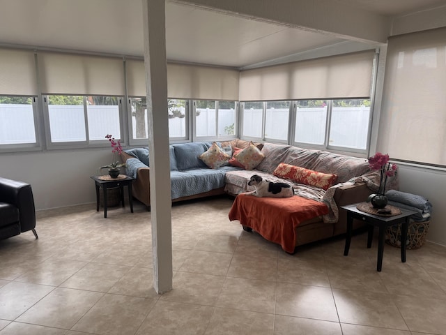 living room featuring light tile patterned floors and a healthy amount of sunlight