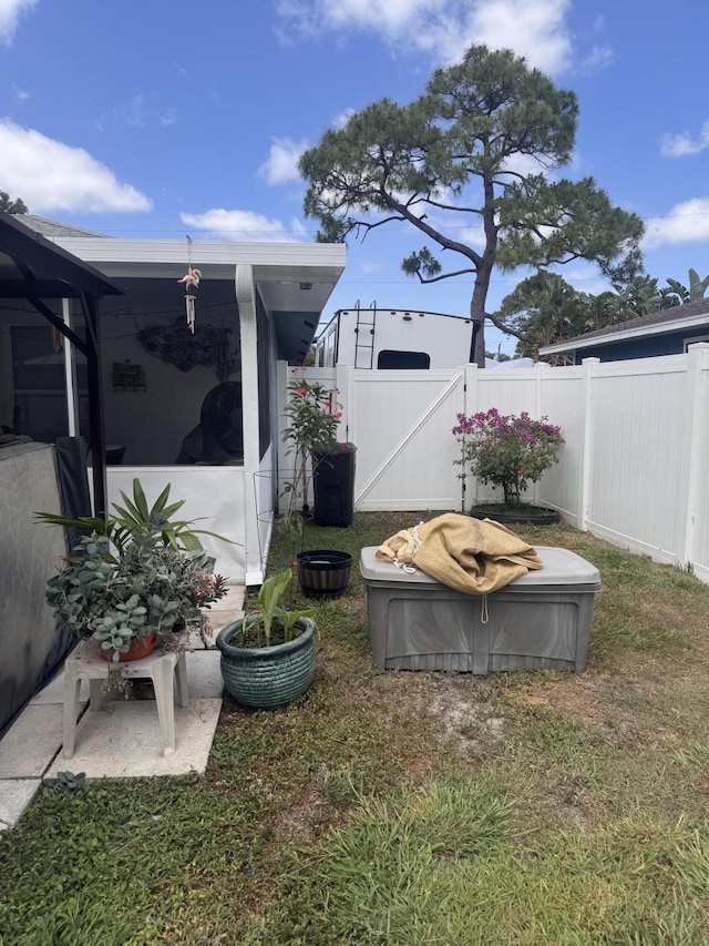 view of yard with fence and a gate