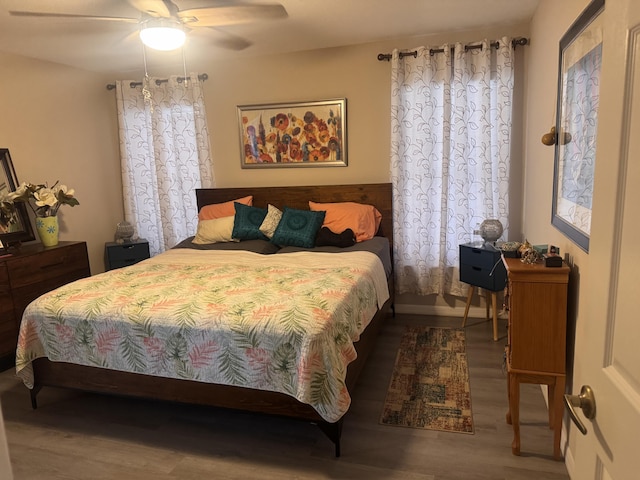 bedroom featuring ceiling fan and wood finished floors