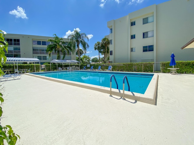 community pool featuring a patio area