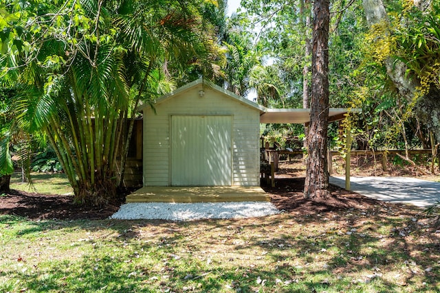 view of shed featuring fence