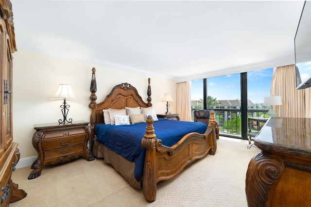 4740 S Ocean Blvd Unit 511, Highland Beach, FL 33487 - bedroom with baseboards, a wall of windows, light carpet, and ornamental molding