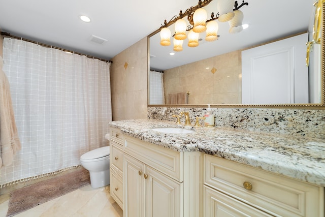 4740 S Ocean Blvd Unit 511, Highland Beach, FL 33487 - full bathroom with vanity, toilet, tile patterned floors, tile walls, and decorative backsplash