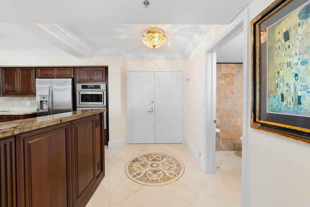 4740 S Ocean Blvd Unit 511, Highland Beach, FL 33487 - kitchen with crown molding, appliances with stainless steel finishes, dark brown cabinetry, and a notable chandelier