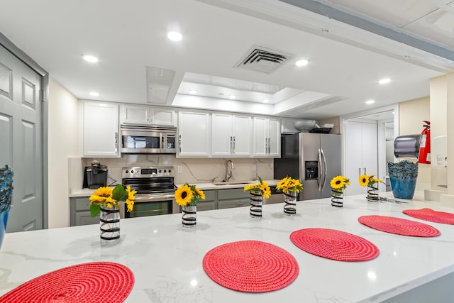 4740 S Ocean Blvd Unit 511, Highland Beach, FL 33487 - kitchen with visible vents, appliances with stainless steel finishes, tasteful backsplash, a sink, and recessed lighting