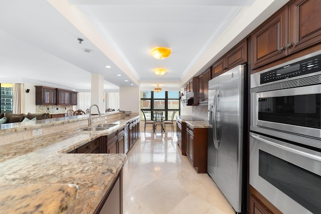 4740 S Ocean Blvd Unit 511, Highland Beach, FL 33487 - kitchen featuring a sink, decorative backsplash, ornamental molding, and stainless steel appliances