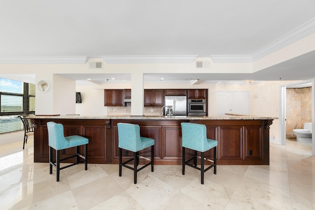 4740 S Ocean Blvd Unit 511, Highland Beach, FL 33487 - kitchen featuring crown molding, appliances with stainless steel finishes, visible vents, and tasteful backsplash