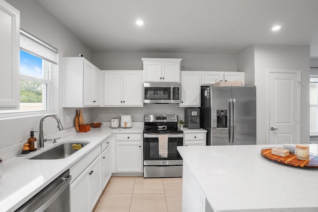 3625 Sapphire Hollow Way, Fort Pierce, FL 34981 - kitchen featuring stainless steel appliances, recessed lighting, a sink, white cabinetry, and light countertops