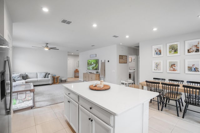 3625 Sapphire Hollow Way, Fort Pierce, FL 34981 - kitchen featuring light tile patterned floors, visible vents, ceiling fan, light countertops, and a kitchen island