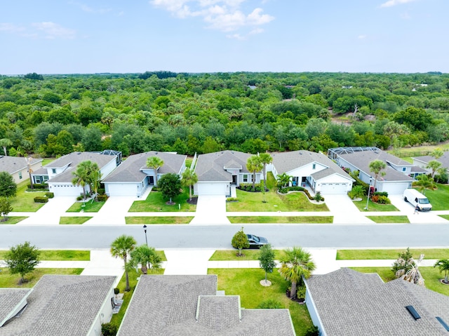 3625 Sapphire Hollow Way, Fort Pierce, FL 34981 - drone / aerial view with a wooded view and a residential view