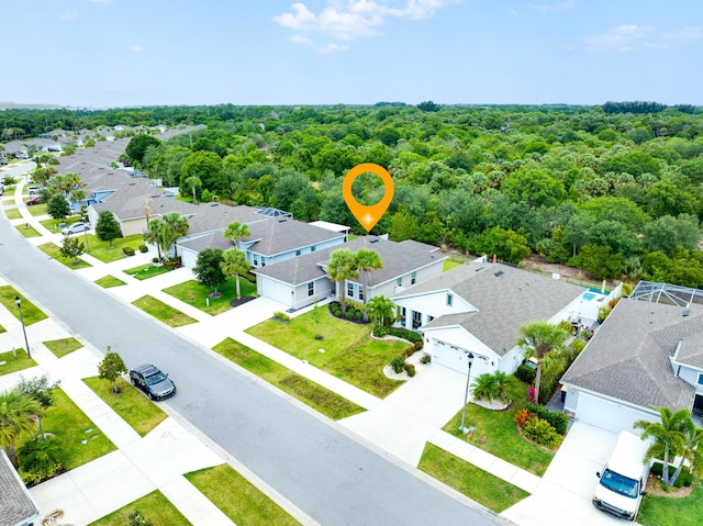3625 Sapphire Hollow Way, Fort Pierce, FL 34981 - birds eye view of property featuring a wooded view and a residential view