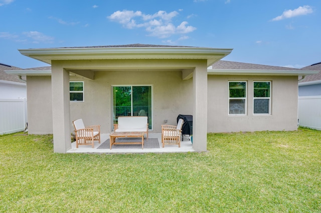 3625 Sapphire Hollow Way, Fort Pierce, FL 34981 - back of house featuring fence, a shingled roof, stucco siding, and a lawn