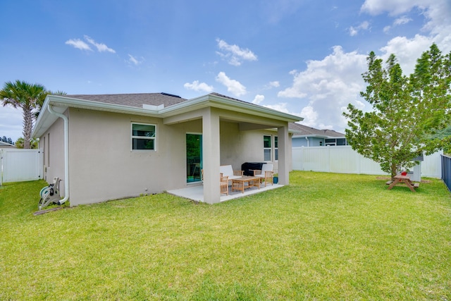 3625 Sapphire Hollow Way, Fort Pierce, FL 34981 - rear view of house with a yard, a patio area, stucco siding, and a fenced backyard