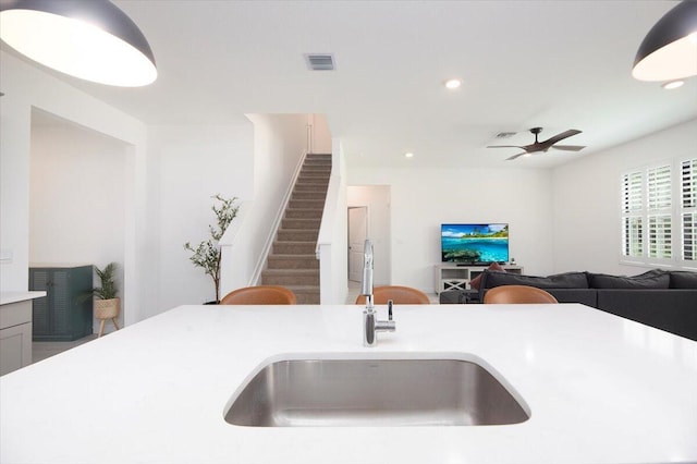 kitchen with visible vents, ceiling fan, recessed lighting, light countertops, and a sink