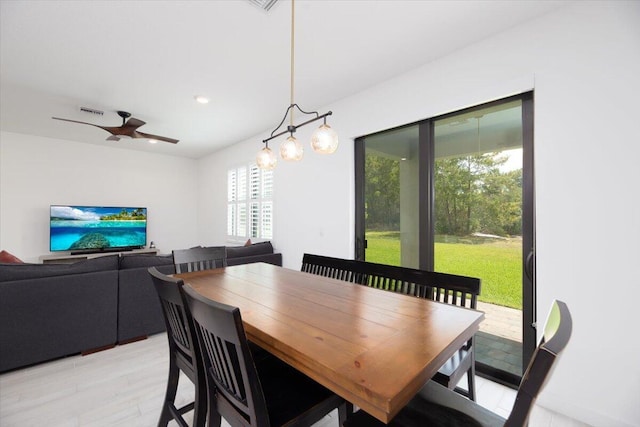 dining room with light wood-style floors, ceiling fan, recessed lighting, and visible vents