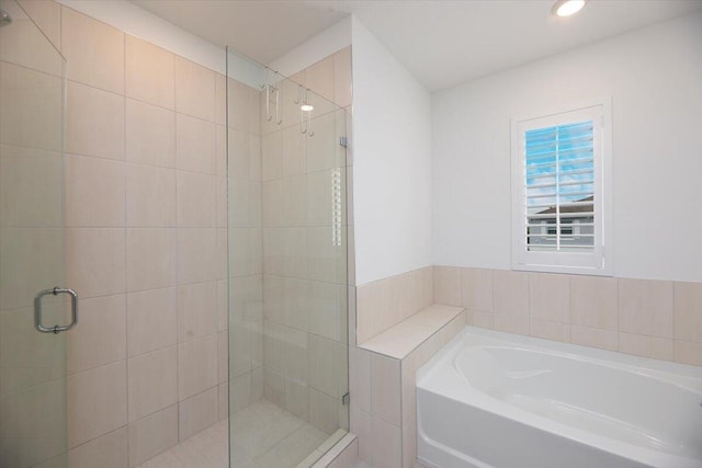full bath featuring a garden tub, recessed lighting, and a stall shower