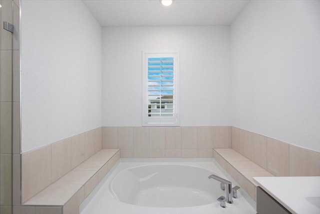full bath with vanity, recessed lighting, and a bath
