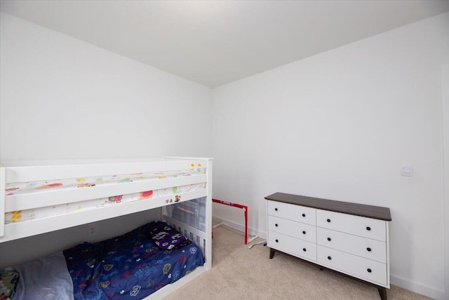 carpeted bedroom with baseboards