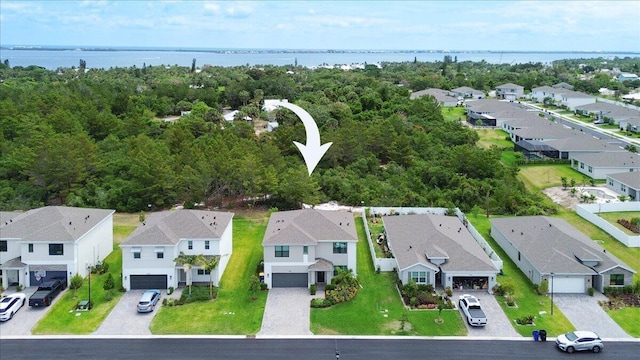aerial view with a residential view and a water view