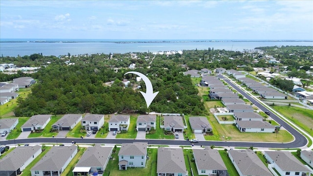 aerial view with a water view and a residential view