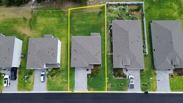 birds eye view of property with a residential view