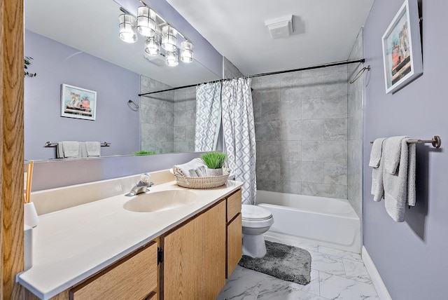 bathroom featuring vanity, toilet, shower / bath combo with shower curtain, marble finish floor, and baseboards
