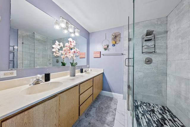 full bathroom with a sink, tile patterned floors, a stall shower, and double vanity
