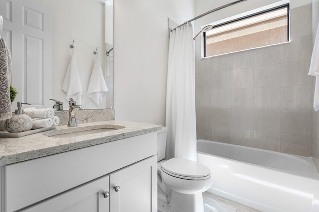 bathroom with toilet, shower / bath combination with curtain, and vanity