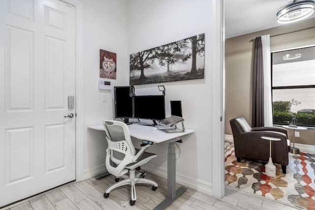 office space with baseboards