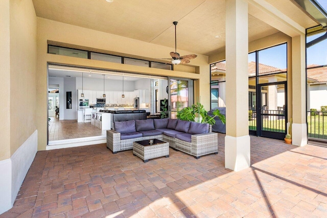 view of patio / terrace featuring a ceiling fan and an outdoor hangout area