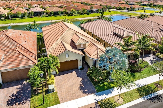 bird's eye view with a residential view and a water view
