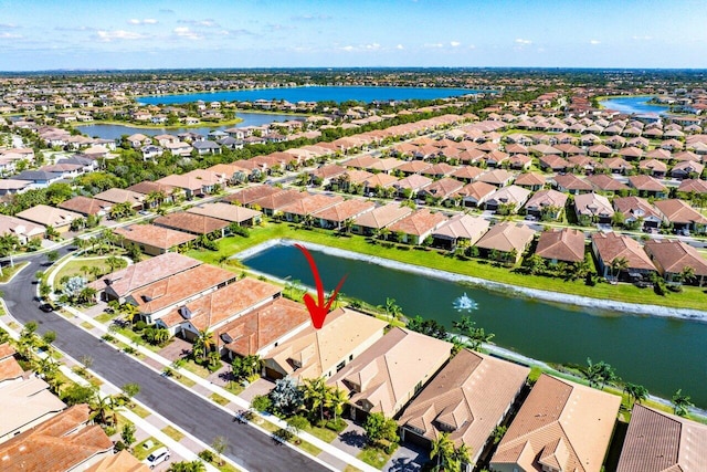 bird's eye view with a residential view and a water view