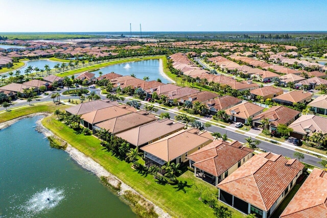 bird's eye view with a residential view and a water view