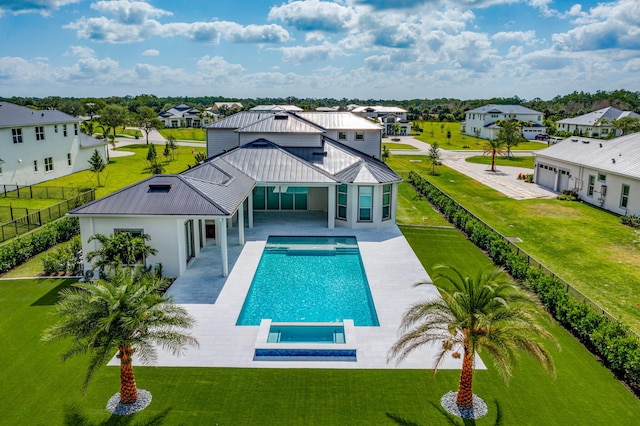 view of pool featuring a lawn, a residential view, a patio area, a fenced in pool, and a fenced backyard